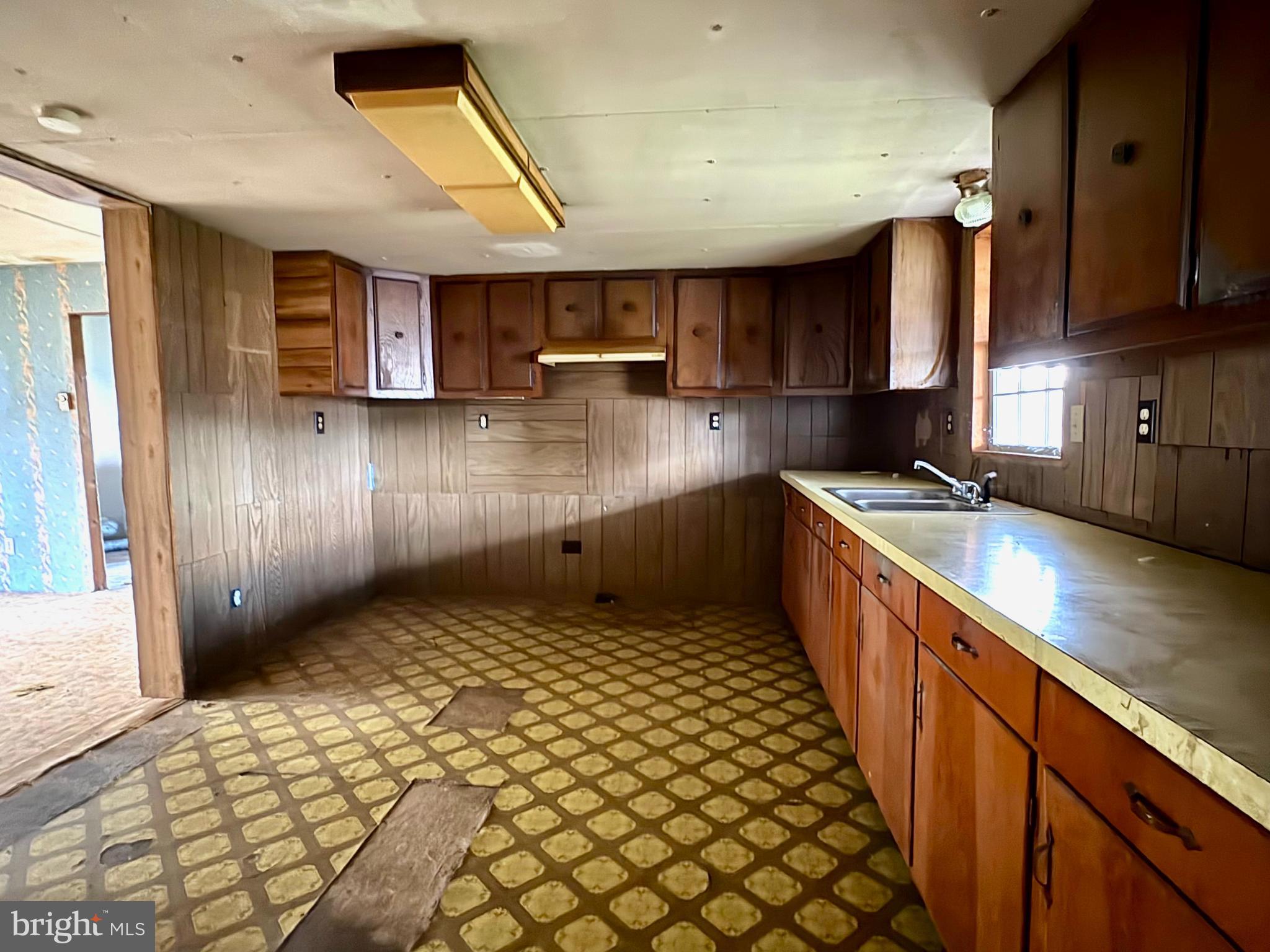 127 Evergreen Road Blanchard, PA 16826 - Photo 6 of 14 a kitchen with stainless steel appliances kitchen island granite countertop a refrigerator and a sink