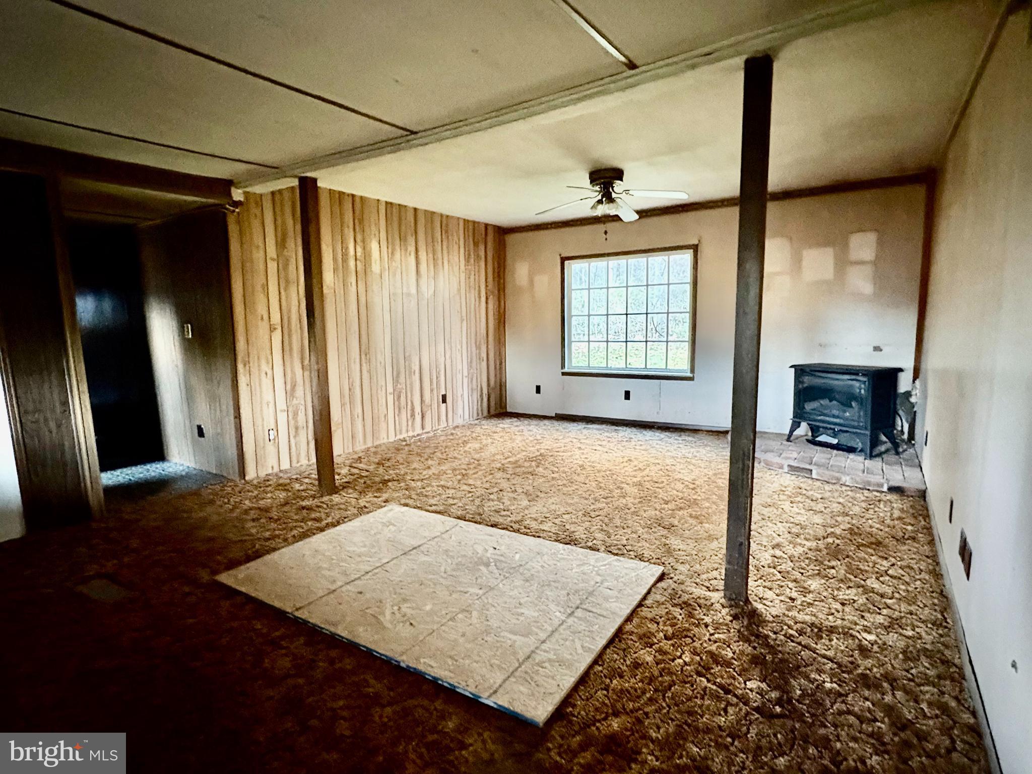 127 Evergreen Road Blanchard, PA 16826 - Photo 8 of 14 a view of livingroom with window and hardwood floor