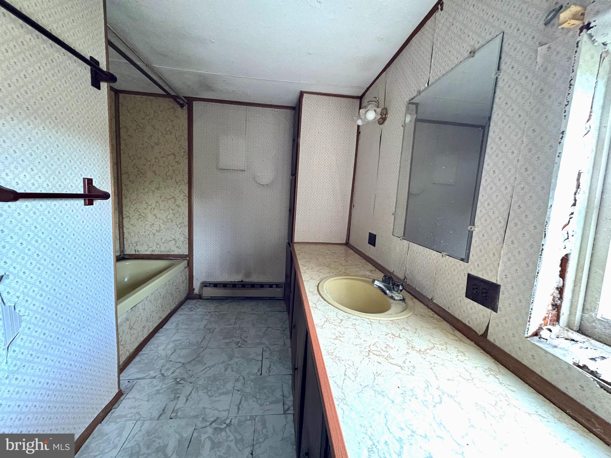 127 Evergreen Road Blanchard, PA 16826 - Photo 10 of 14 a bathroom with a bathtub and a sink