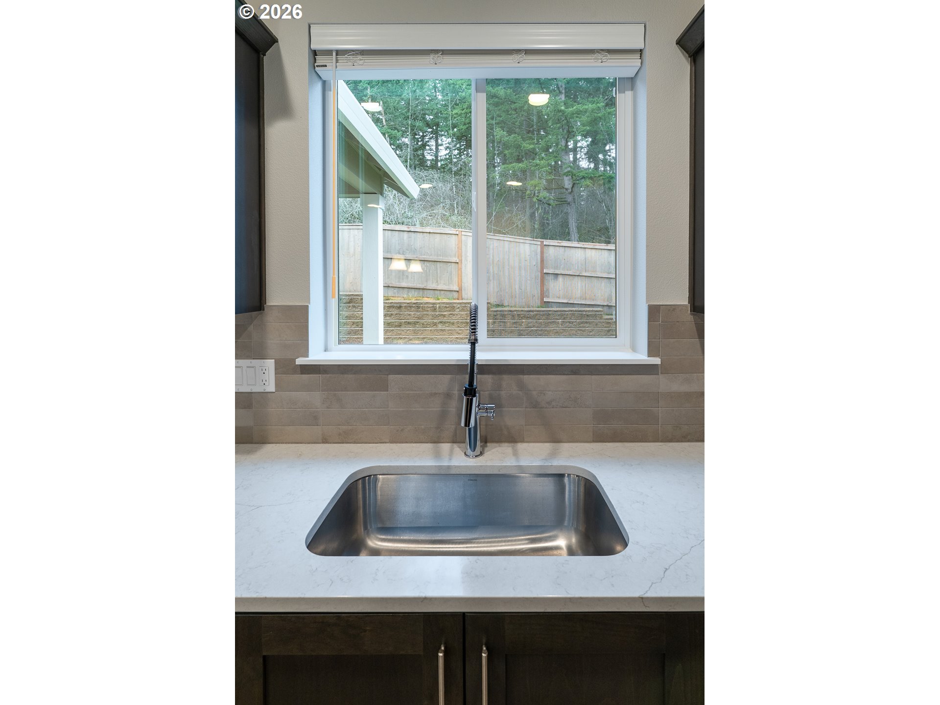 10495 Southeast Heritage Road Happy Valley, OR 97086 - Photo 13 of 46 a kitchen with a sink and a window