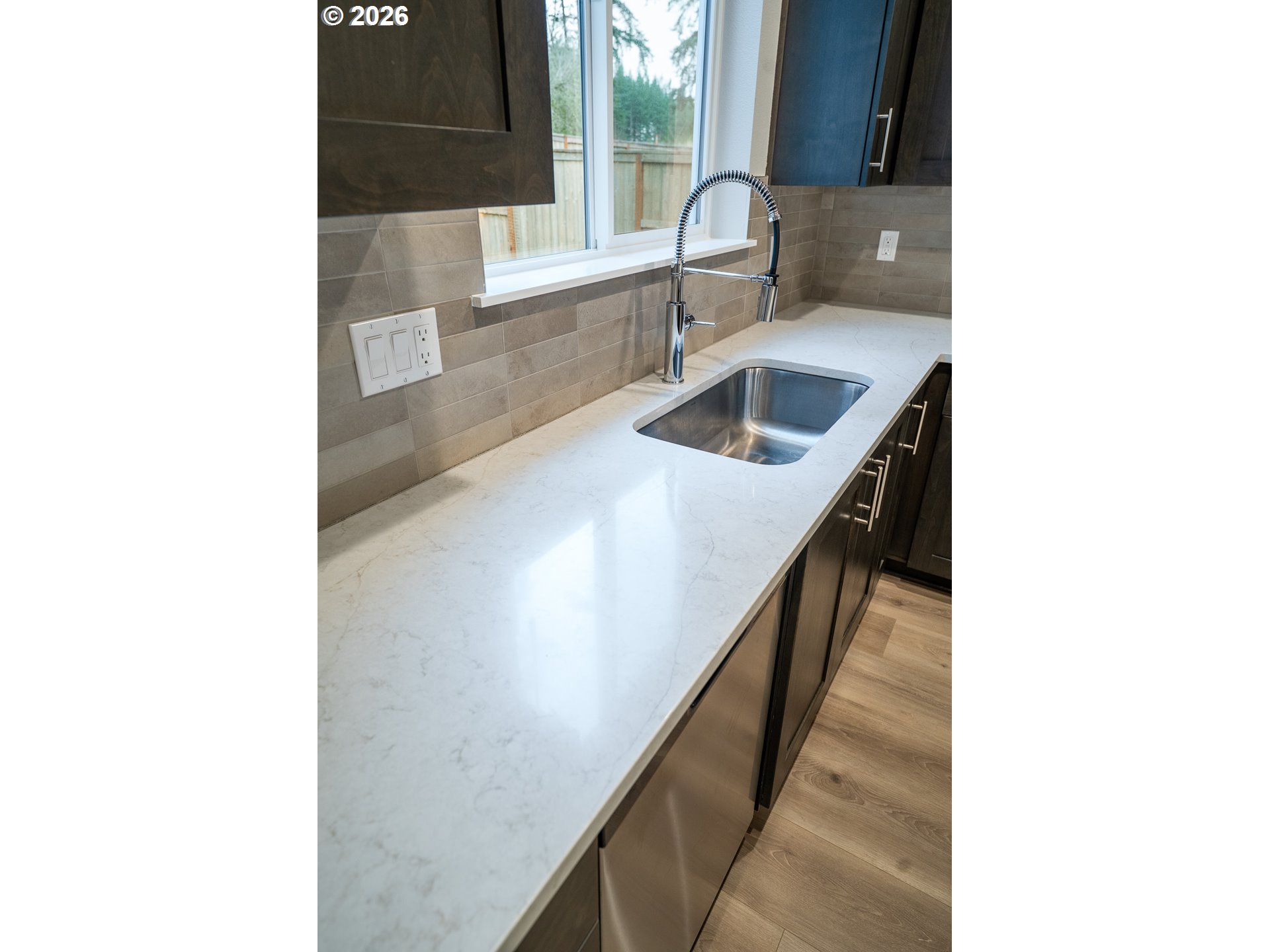 10495 Southeast Heritage Road Happy Valley, OR 97086 - Photo 17 of 46 a kitchen with a sink and a window
