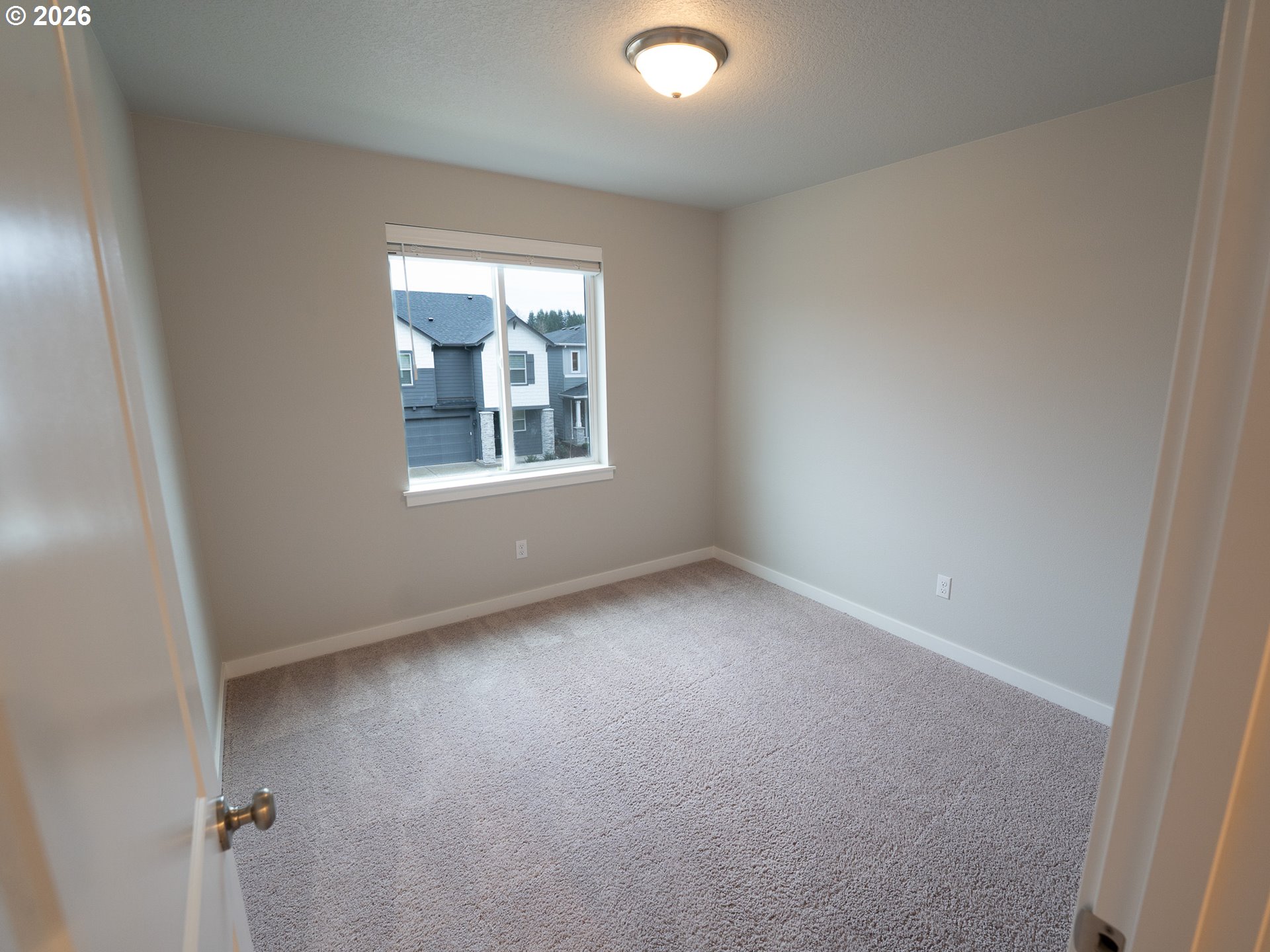 10495 Southeast Heritage Road Happy Valley, OR 97086 - Photo 20 of 46 an empty room with a window