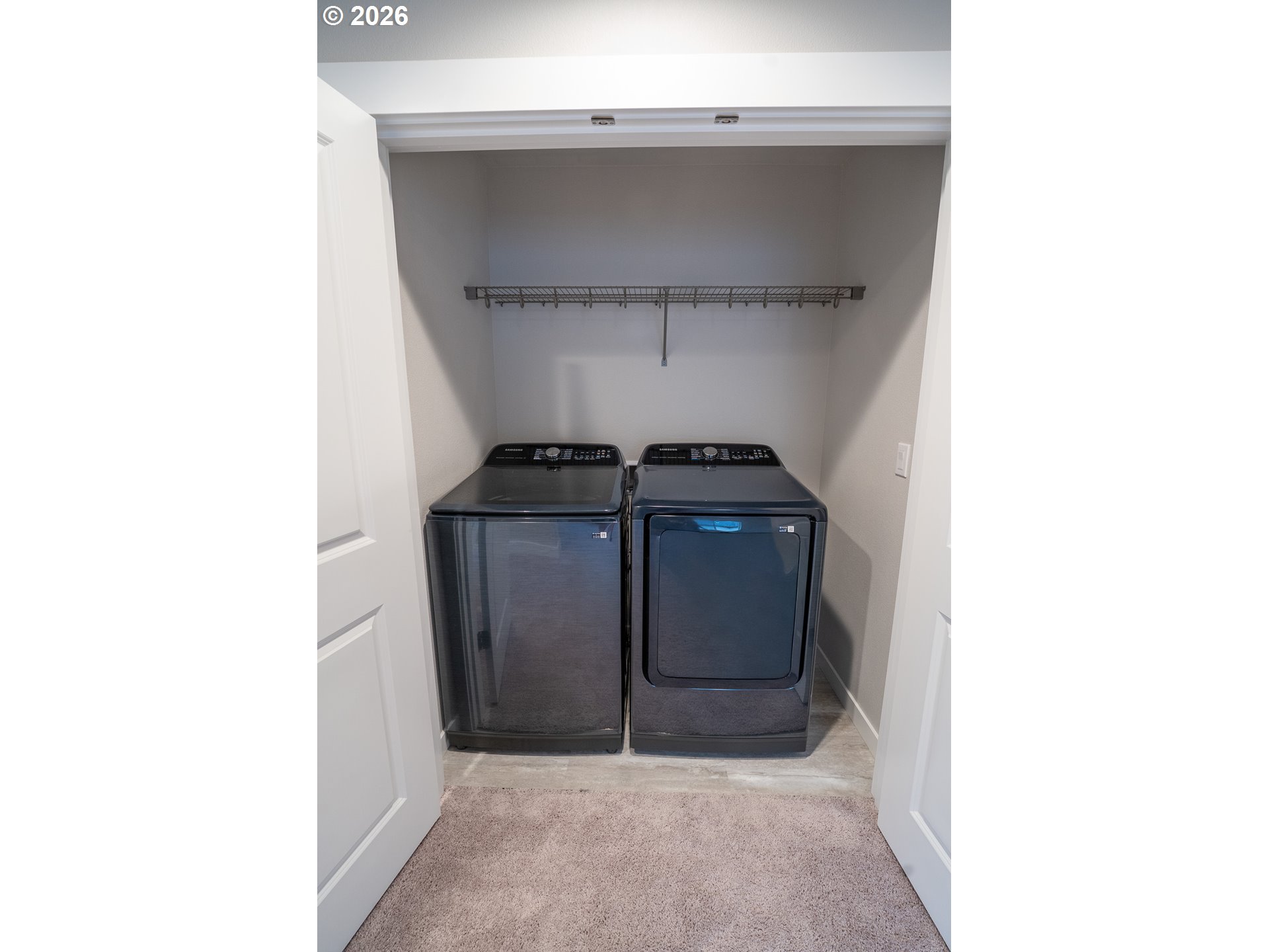 10495 Southeast Heritage Road Happy Valley, OR 97086 - Photo 24 of 46 a view of storage and utility room with washer and dryer