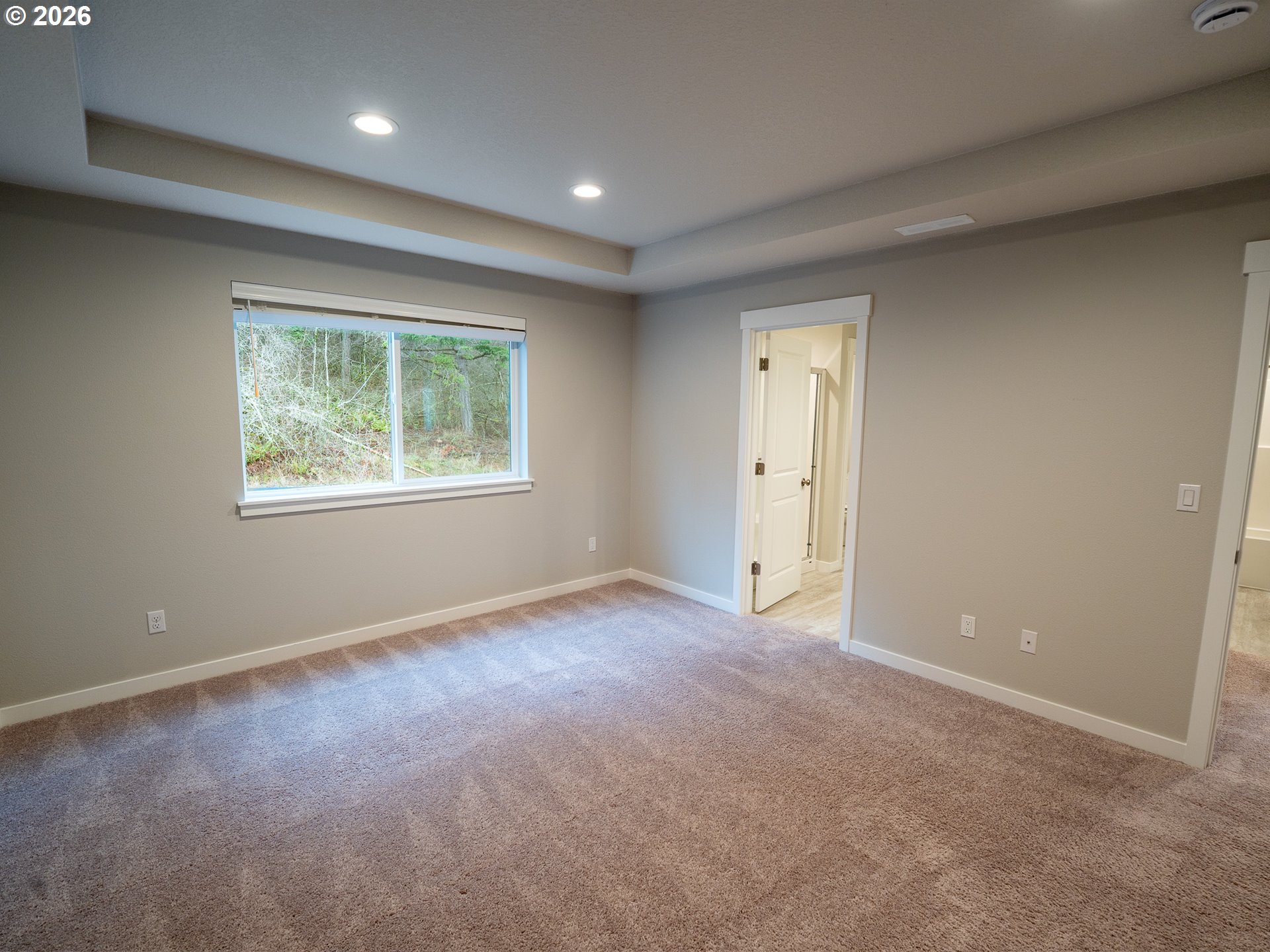 10495 Southeast Heritage Road Happy Valley, OR 97086 - Photo 26 of 46 an empty room with windows and closet area