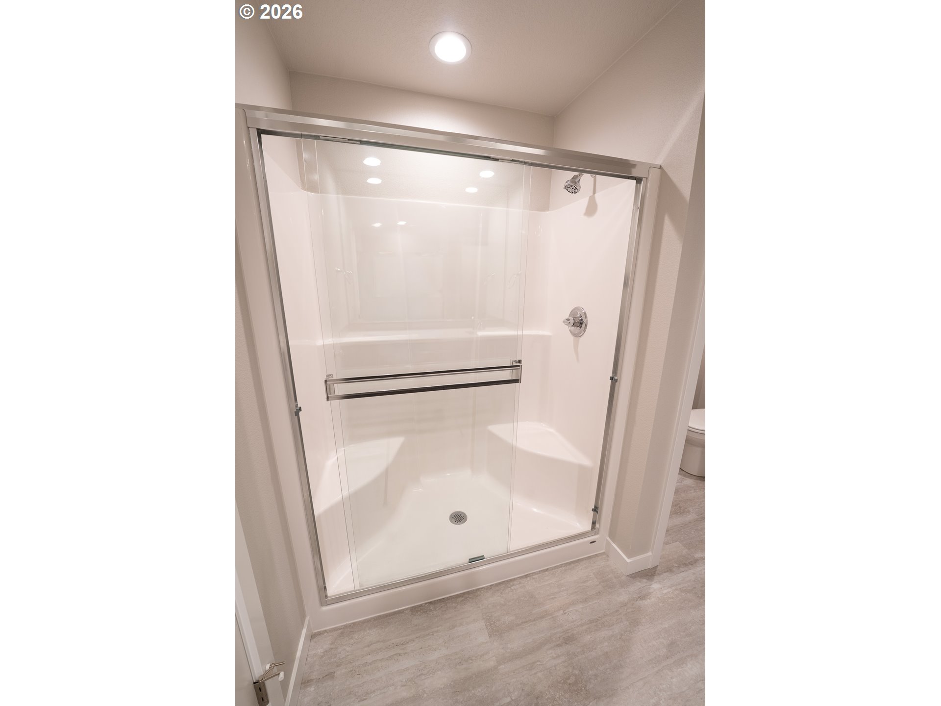 10495 Southeast Heritage Road Happy Valley, OR 97086 - Photo 31 of 46 a bathroom with a glass shower door