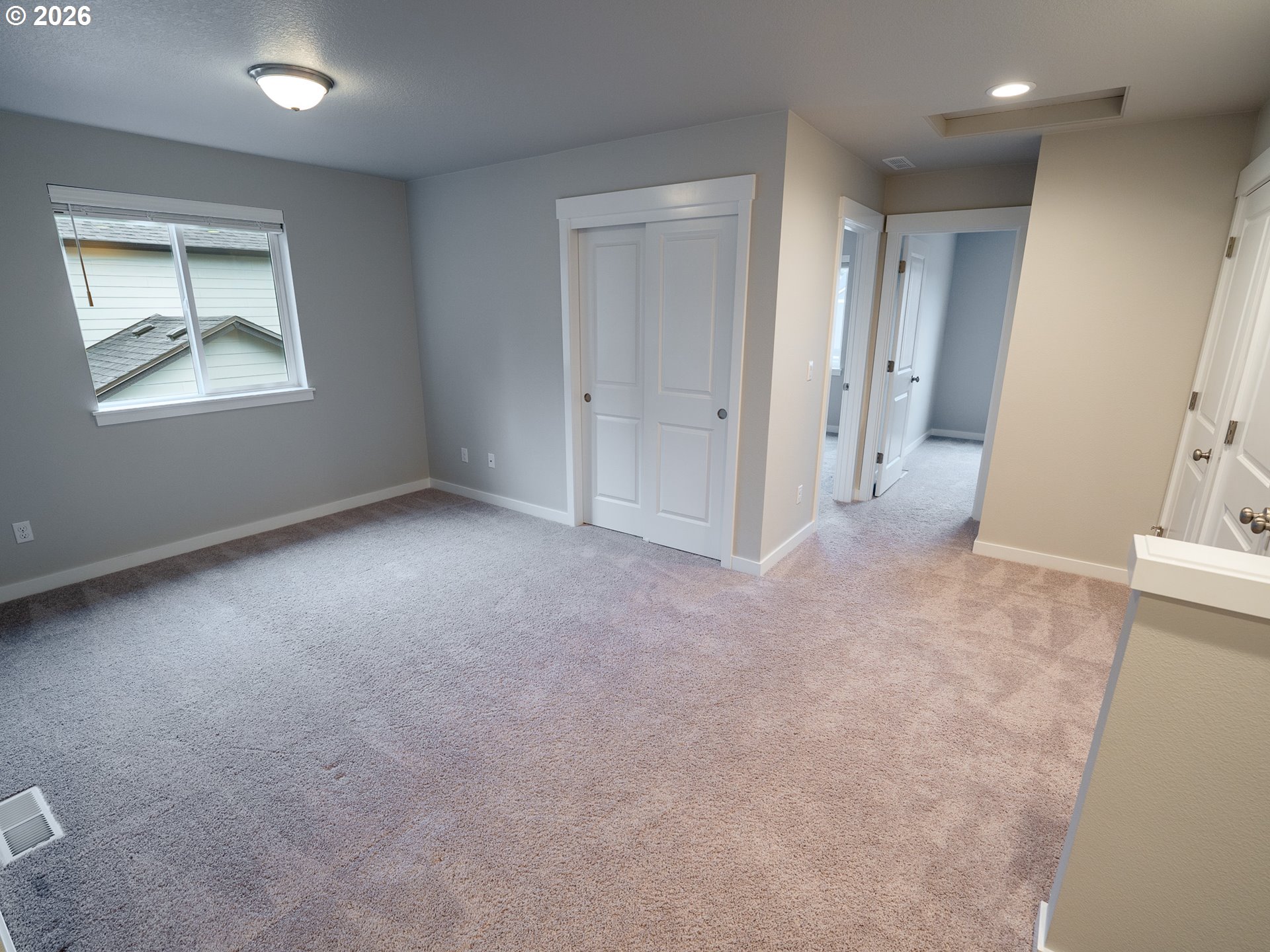 10495 Southeast Heritage Road Happy Valley, OR 97086 - Photo 32 of 46 an empty room with windows and closet
