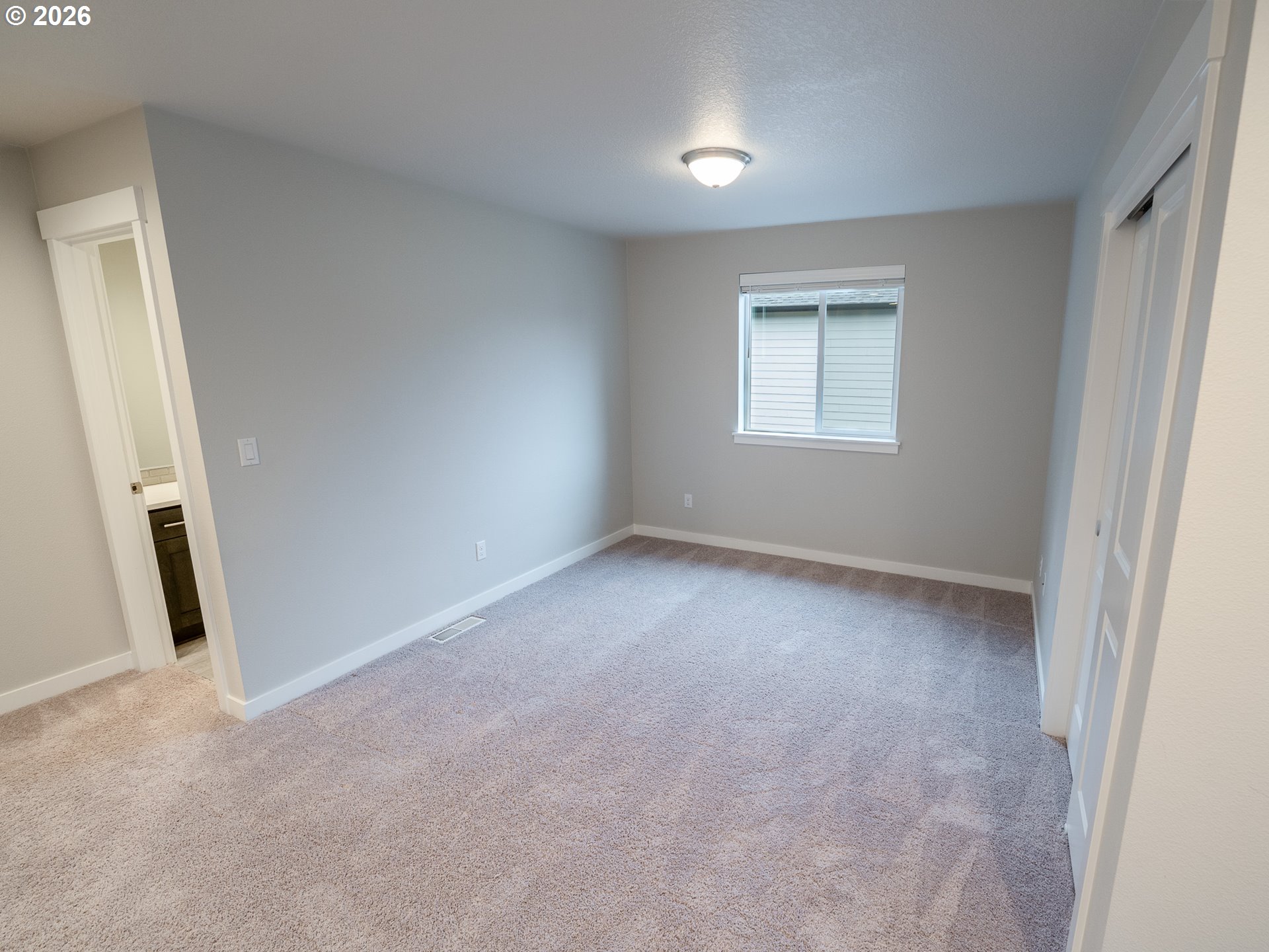 10495 Southeast Heritage Road Happy Valley, OR 97086 - Photo 33 of 46 an empty room with a window