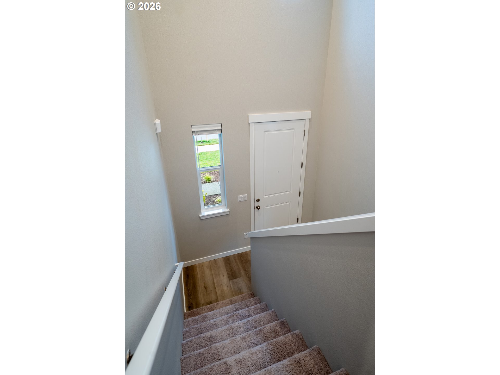 10495 Southeast Heritage Road Happy Valley, OR 97086 - Photo 37 of 46 a view of an empty room with wooden floor
