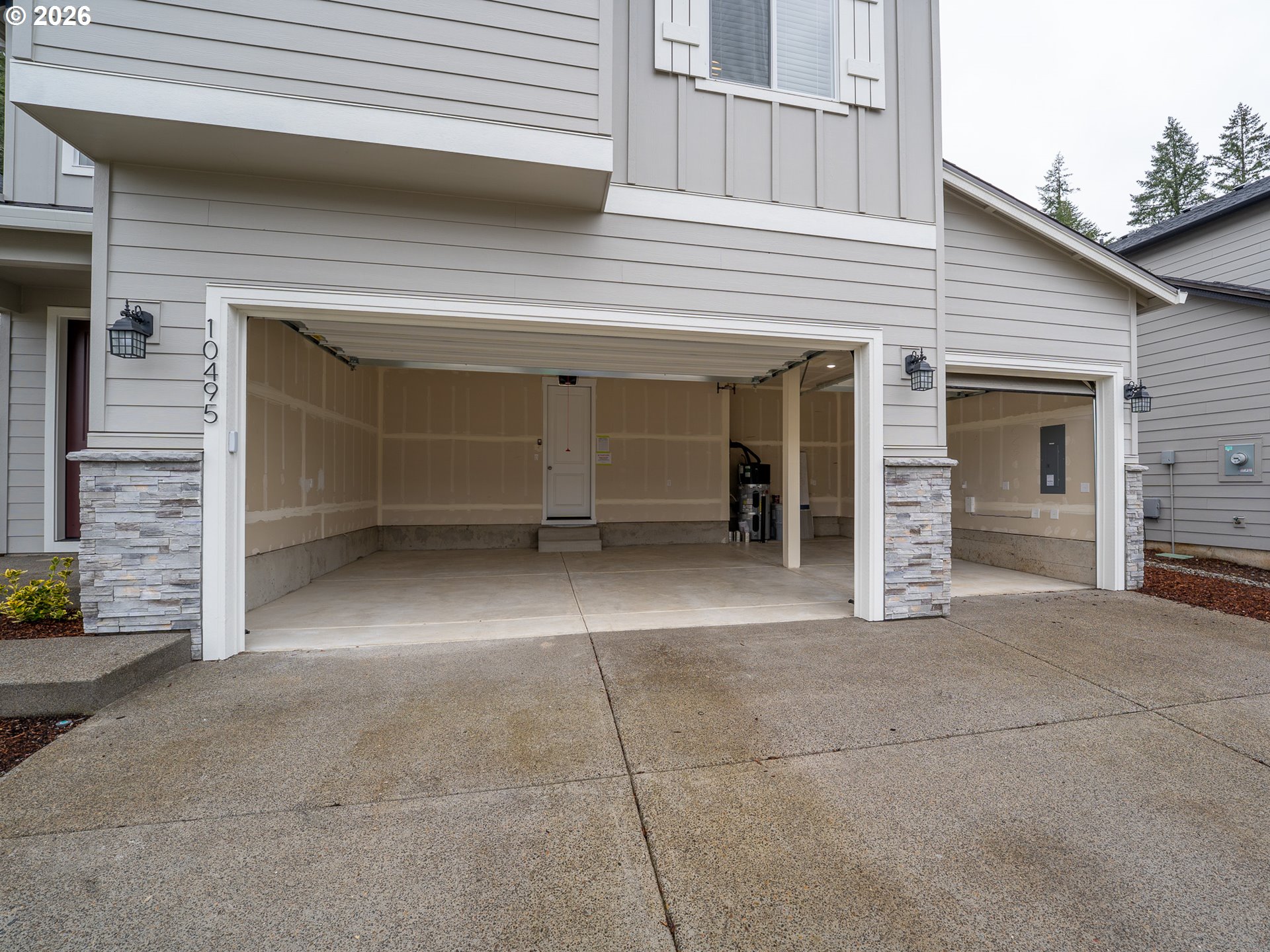10495 Southeast Heritage Road Happy Valley, OR 97086 - Photo 43 of 46 a view of a house with a garage