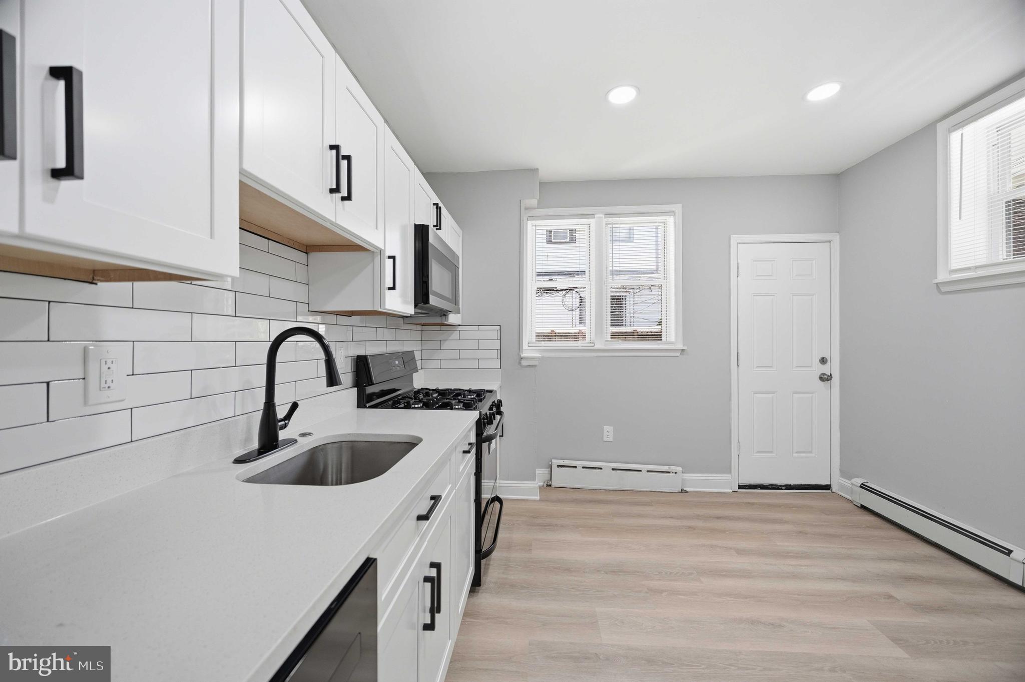 2139 South 15th Street Philadelphia, PA 19145 - Photo 15 of 33 Kitchen access to rear yard.