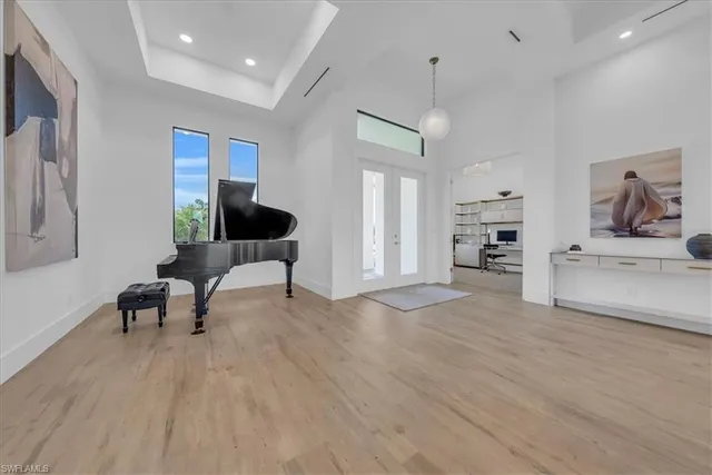 a living room with furniture and a kitchen view