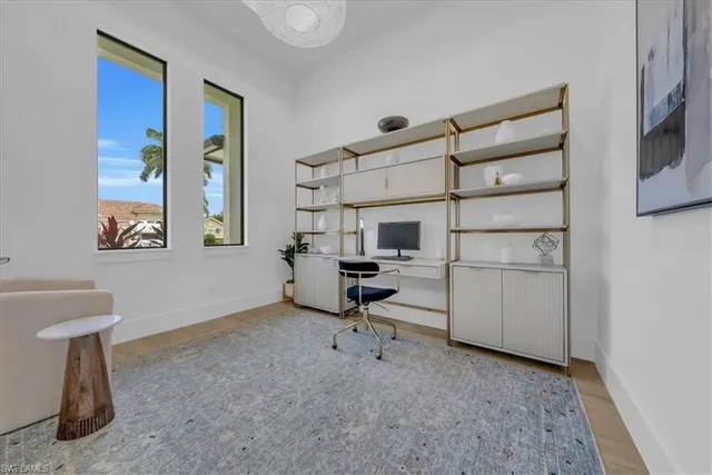 a view of a workspace with furniture