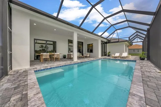 a view of a swimming pool with a patio