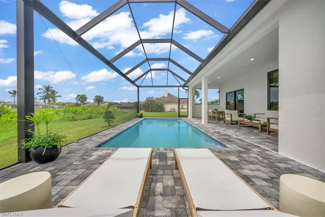 a view of swimming pool with a patio