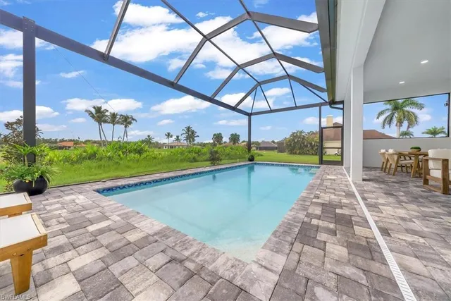 a view of a swimming pool with a porch