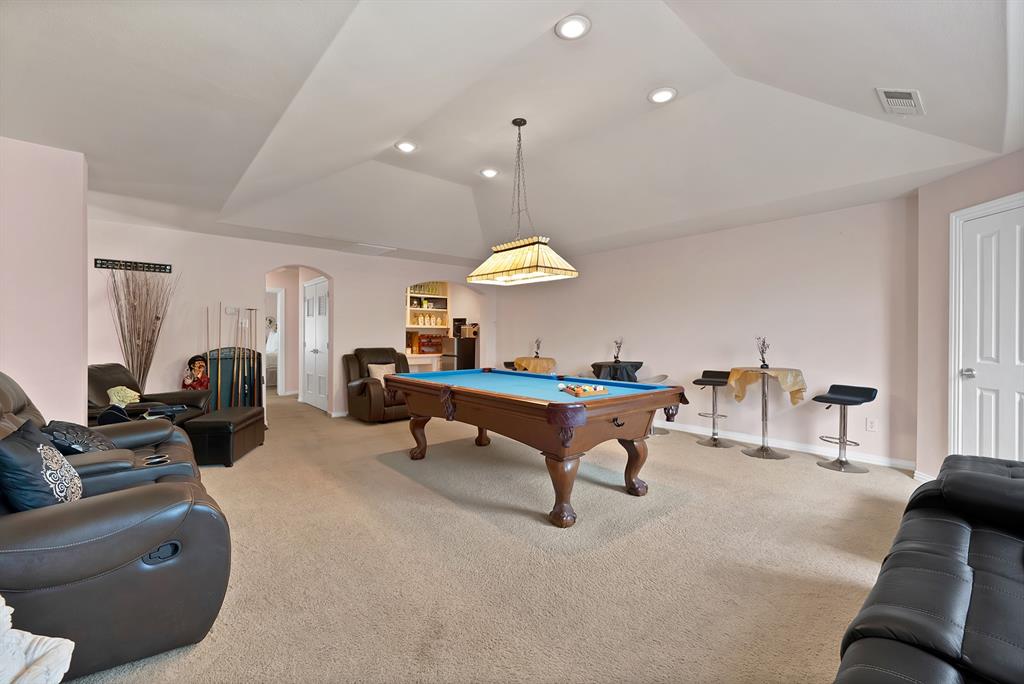 1014 Ricci Court Irving, TX 75062 - Photo 18 of 30 Game room featuring arched walkways, light colored carpet, pool table, recessed lighting, and vaulted ceiling