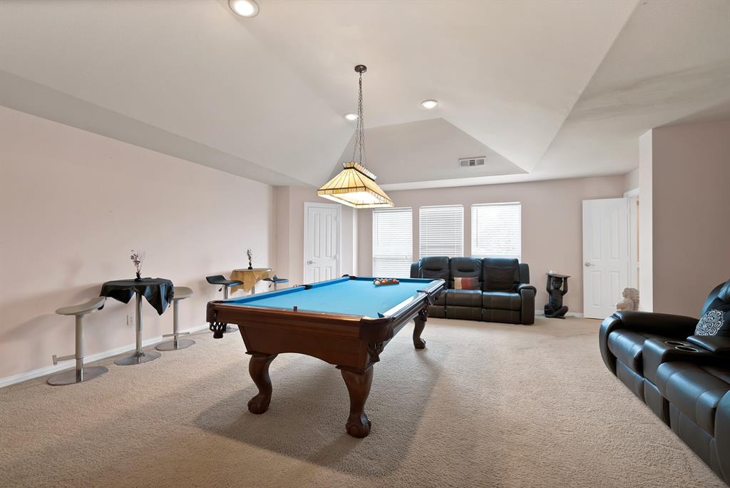 1014 Ricci Court Irving, TX 75062 - Photo 20 of 30 Recreation room with billiards, carpet flooring, recessed lighting, a raised ceiling, and lofted ceiling