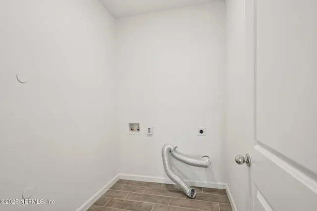a bathroom with a toilet and a rug