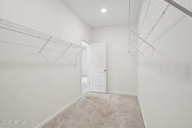 a view of a room with racks on the wall