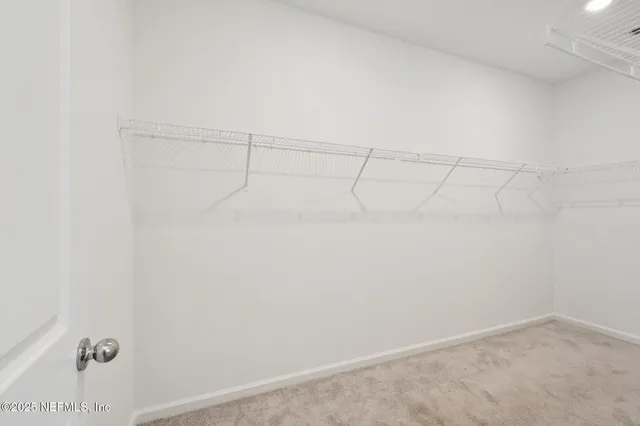 a bathroom with a tub shower sink and mirror