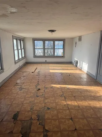 a view of empty room with windows