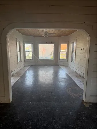 en empty room with windows