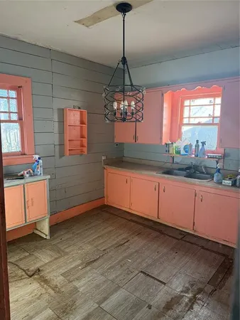 a kitchen with granite countertop a stove a sink and a granite counter tops