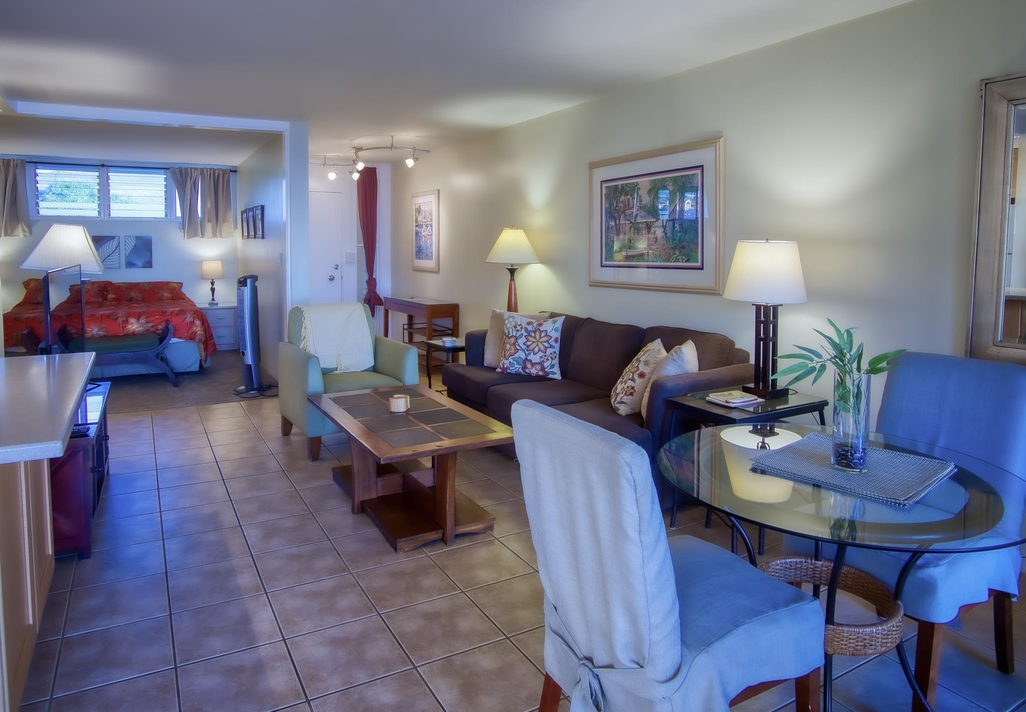 3823 Lower Honoapiilani Road, Unit 311 Lahaina, HI 96761 - Photo 11 of 20 a living room with furniture and a lamp