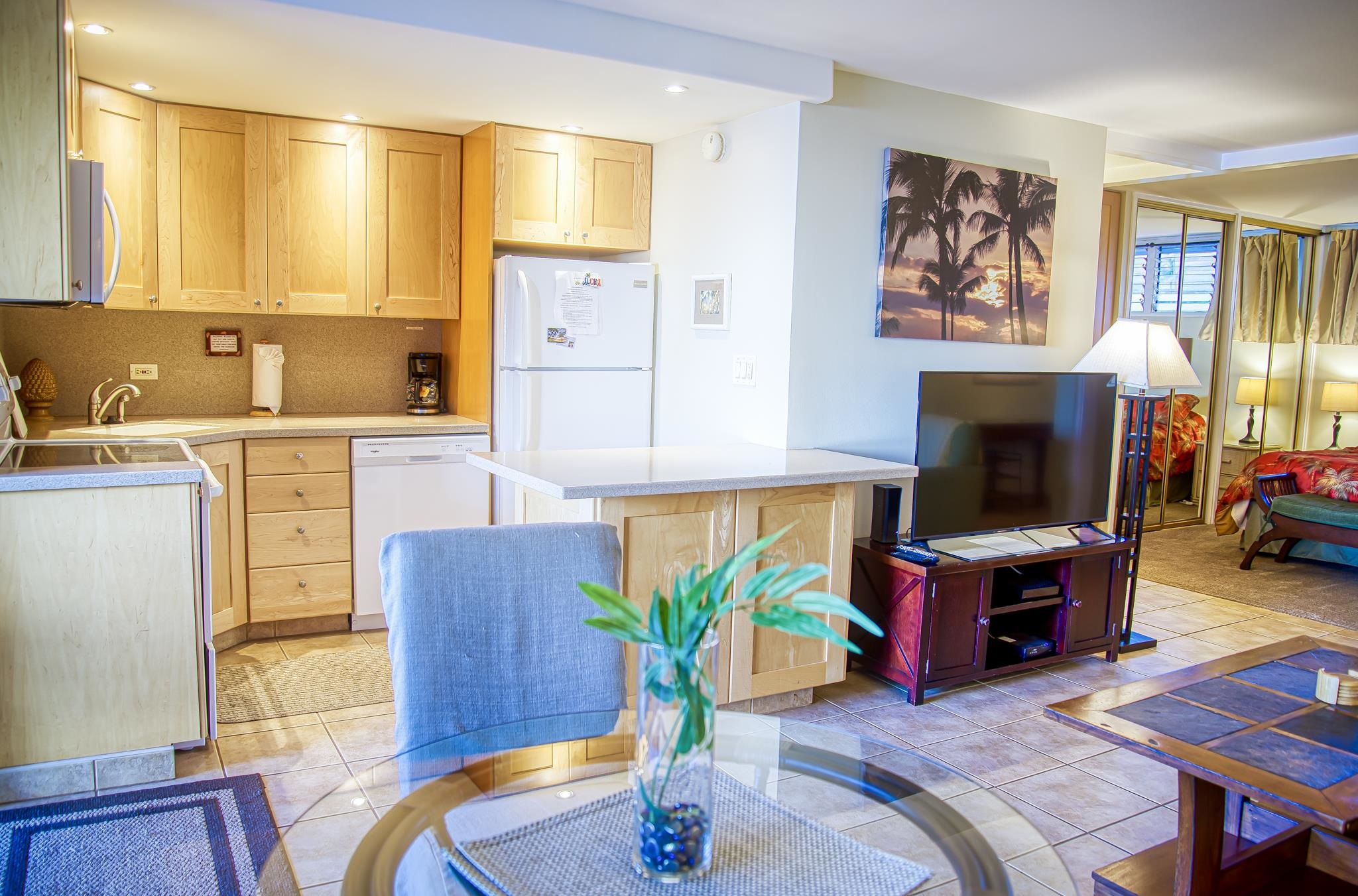 3823 Lower Honoapiilani Road, Unit 311 Lahaina, HI 96761 - Photo 15 of 20 a living room with furniture a flat screen tv and a fireplace