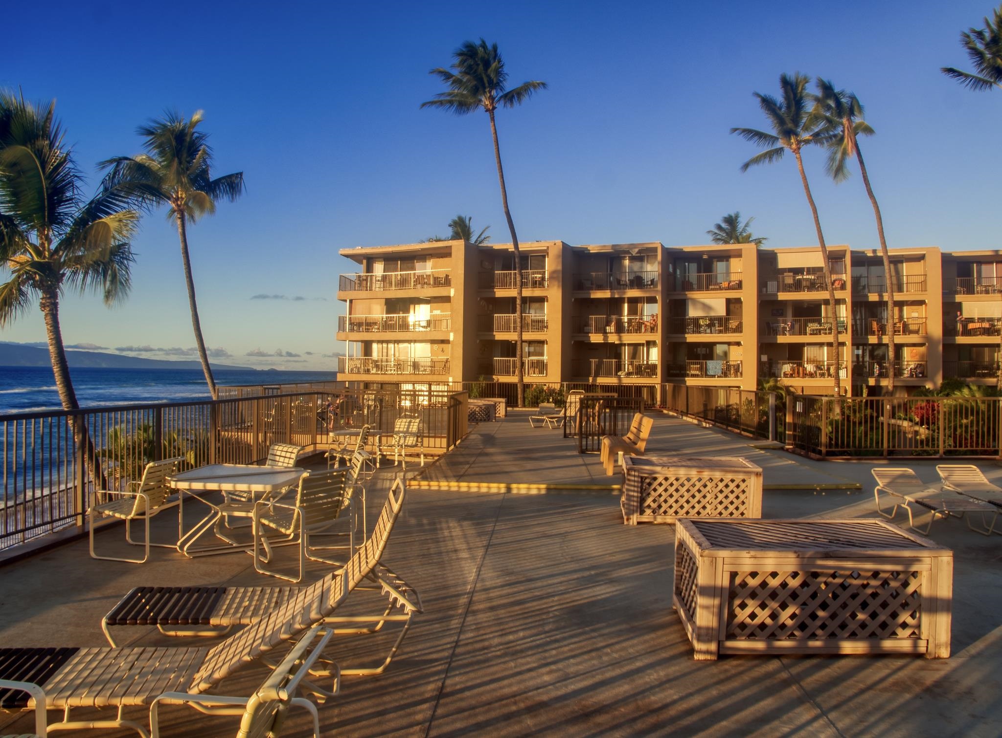 3823 Lower Honoapiilani Road, Unit 311 Lahaina, HI 96761 - Photo 17 of 20 a roof deck with outdoor seating and city view