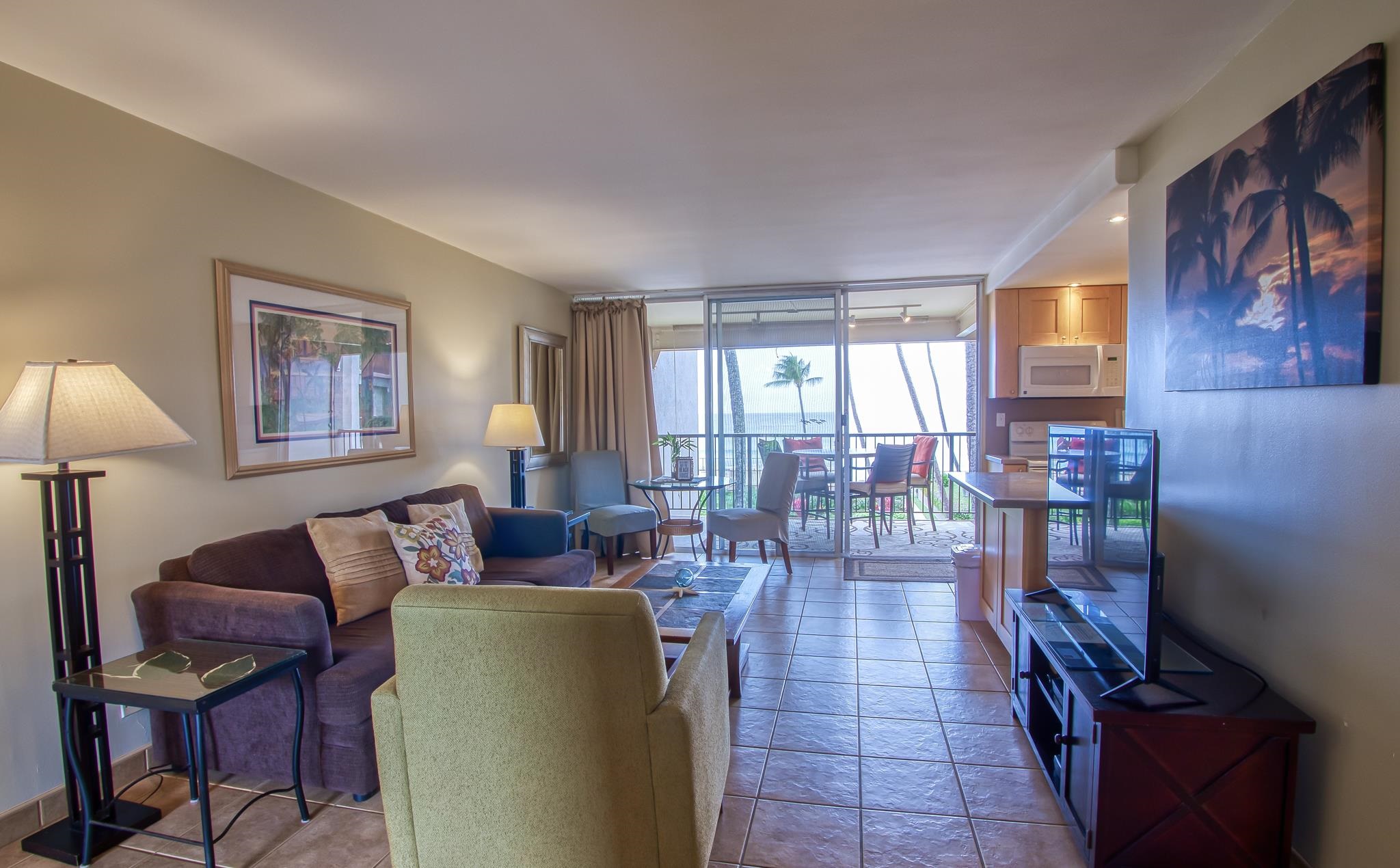 3823 Lower Honoapiilani Road, Unit 311 Lahaina, HI 96761 - Photo 2 of 20 a living room with furniture and a window