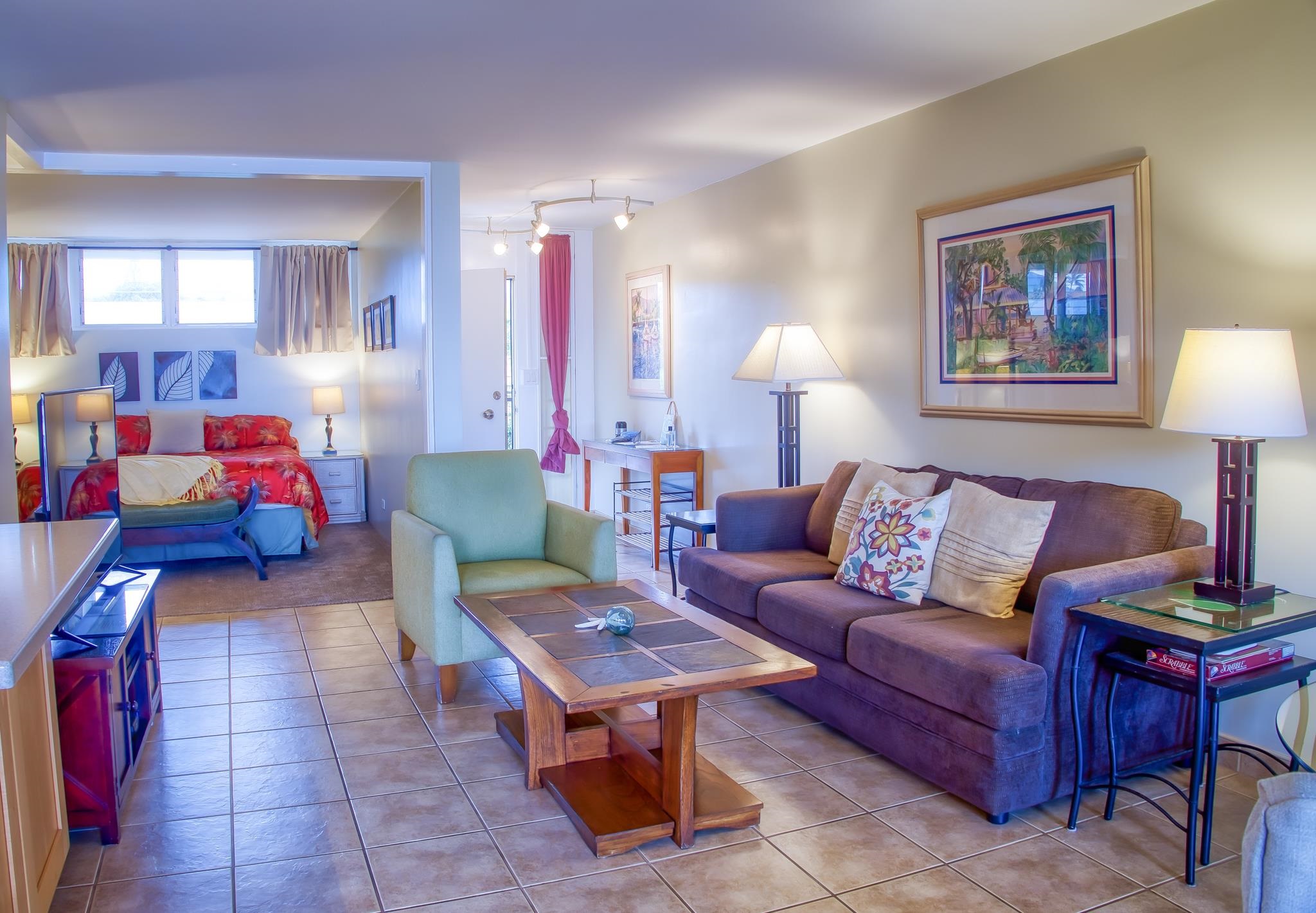 3823 Lower Honoapiilani Road, Unit 311 Lahaina, HI 96761 - Photo 4 of 20 a living room with furniture and a lamp