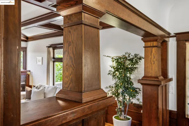 a kitchen with stainless steel appliances granite countertop wooden cabinets a stove a sink and a large window