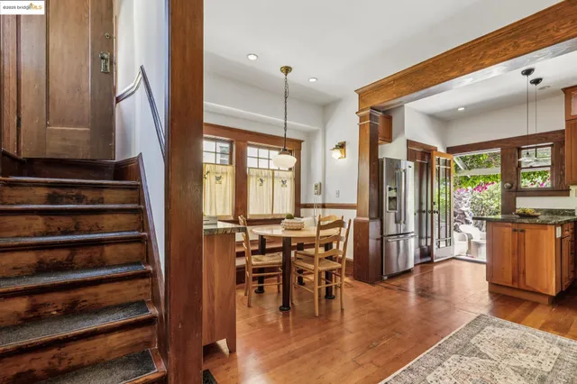 a kitchen with a granite countertop sink a stove and cabinets
