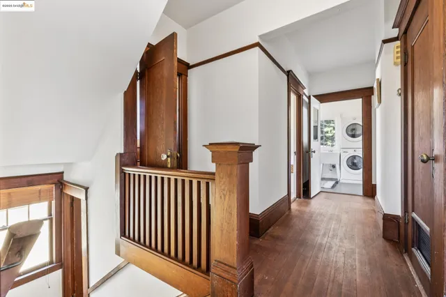 a bedroom with bed and a large window