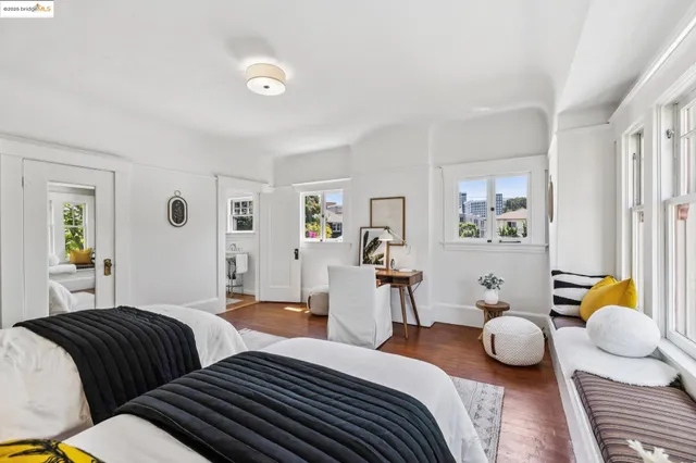 a living room with furniture a window and a table
