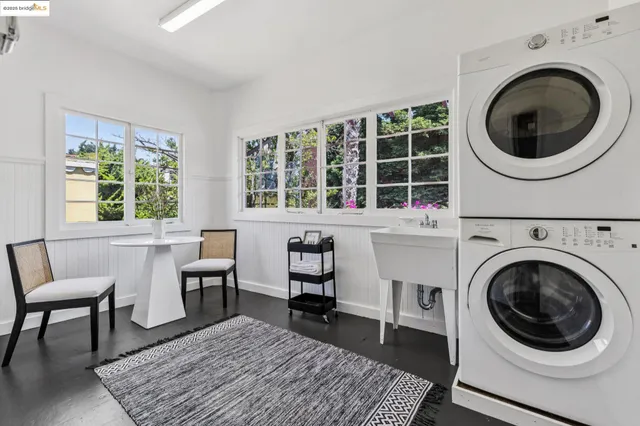 a view of staircase with wooden floor and lots of windows