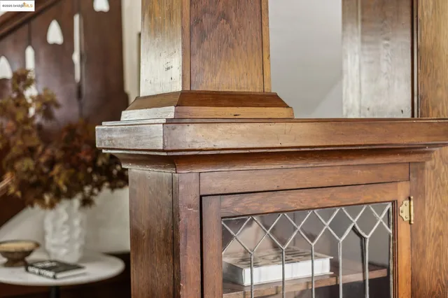 a living room with fireplace furniture and a large window