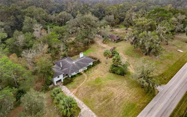 an aerial view of residential house with outdoor space