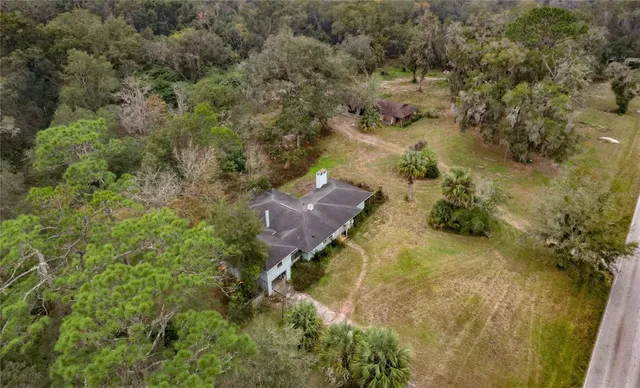 an aerial view of residential house with outdoor space