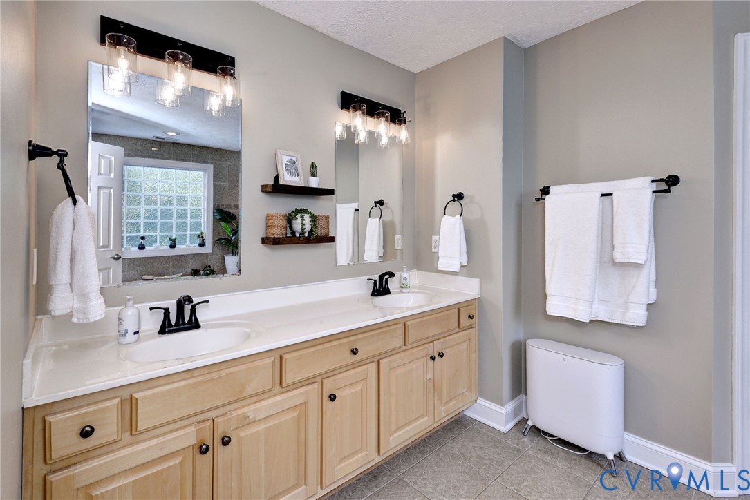 4015 Cold Spring Road Williamsburg, VA 23188 - Photo 26 of 57 Dual vanity with light wood-finish cabinetry, whit