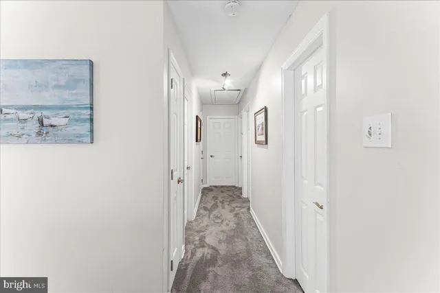 a view of a hallway with white walls