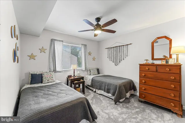 a bedroom with a bed and cabinets