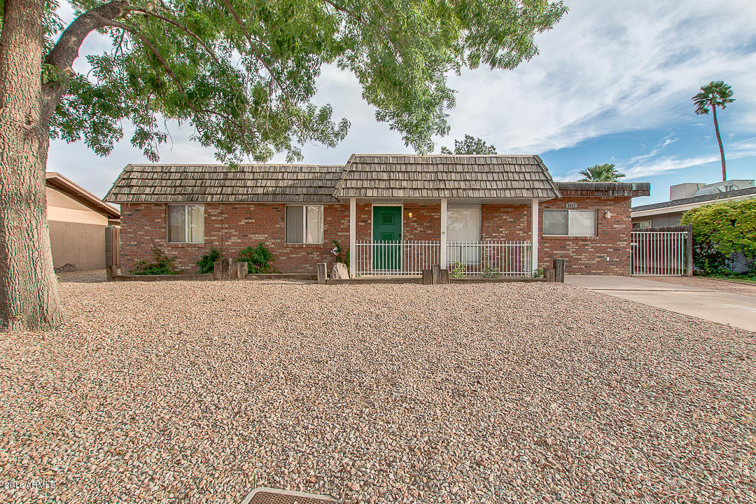 front view of a house with a street