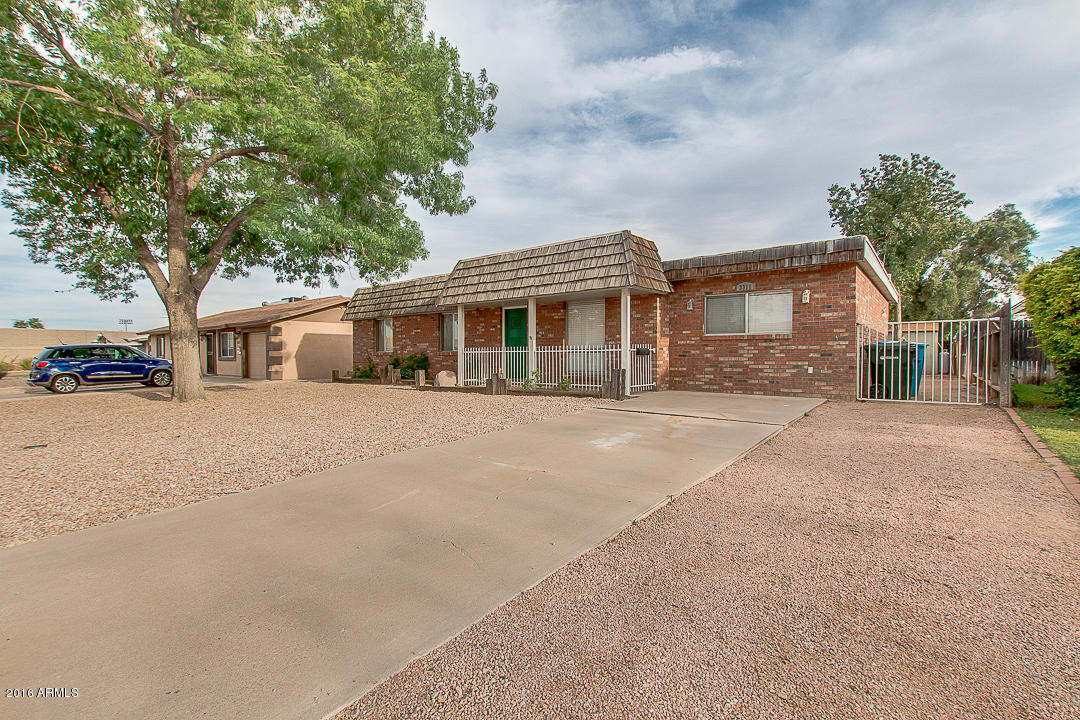 3311 East Bloomfield Road Phoenix, AZ 85032 - Photo 2 of 46 a front view of a house with a yard