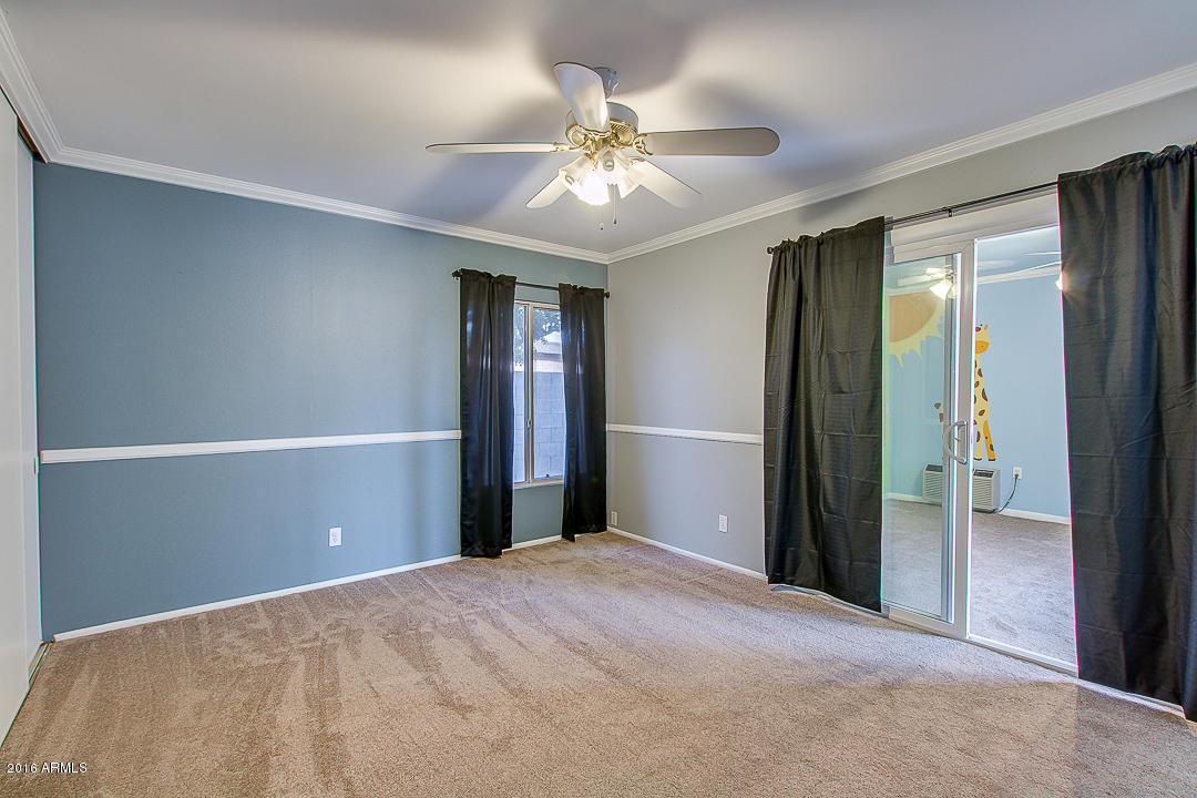 3311 East Bloomfield Road Phoenix, AZ 85032 - Photo 26 of 46 a view of a livingroom with a ceiling fan and window