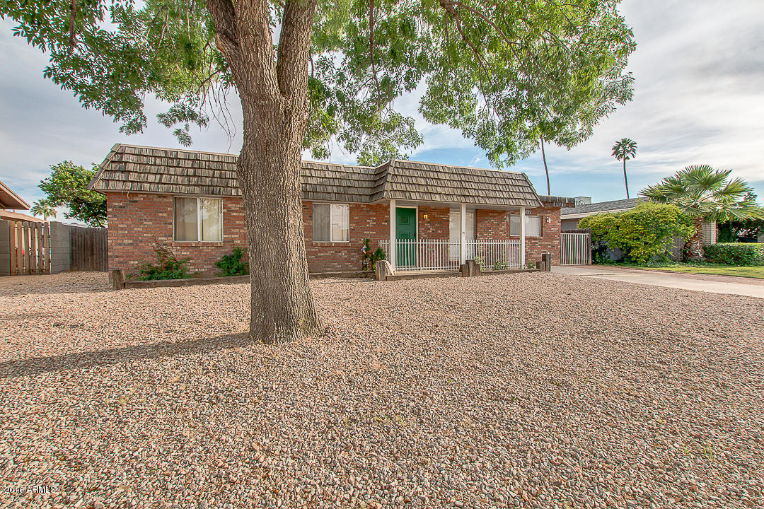3311 East Bloomfield Road Phoenix, AZ 85032 - Photo 3 of 46 a front view of a house with a garden