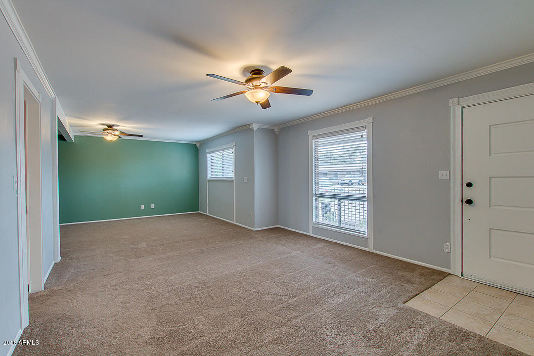 3311 East Bloomfield Road Phoenix, AZ 85032 - Photo 5 of 46 a view of an empty room with a window