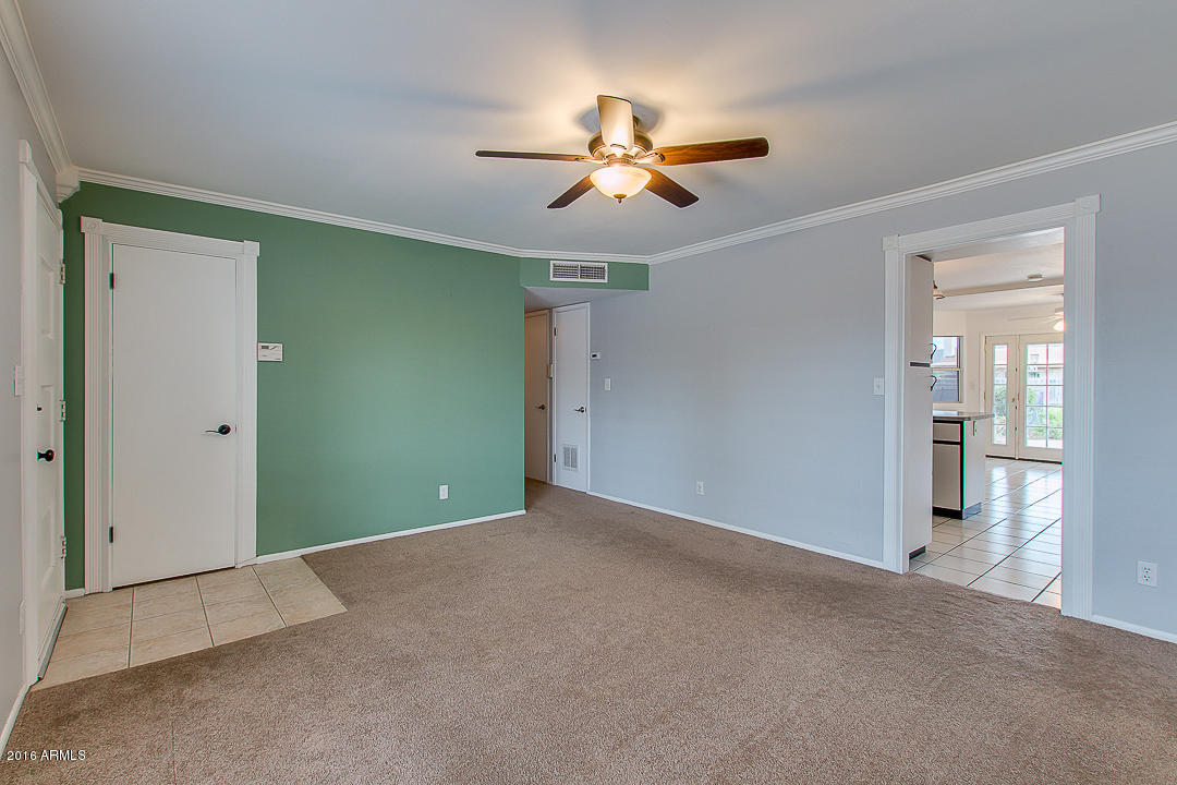 3311 East Bloomfield Road Phoenix, AZ 85032 - Photo 7 of 46 a view of a livingroom with a ceiling fan and entryway