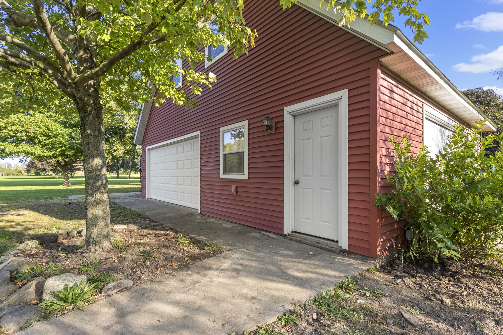 21517 Dunham Road Harvard, IL 60033 - Photo 21 of 36 a front view of a house with garden